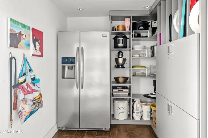 Large walk in Panty and Laundry with extra refrigerator.