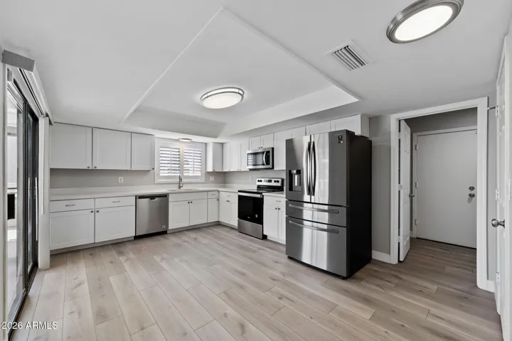 Remodeled and Updated Kitchen with newer appliances, raised ceiling.