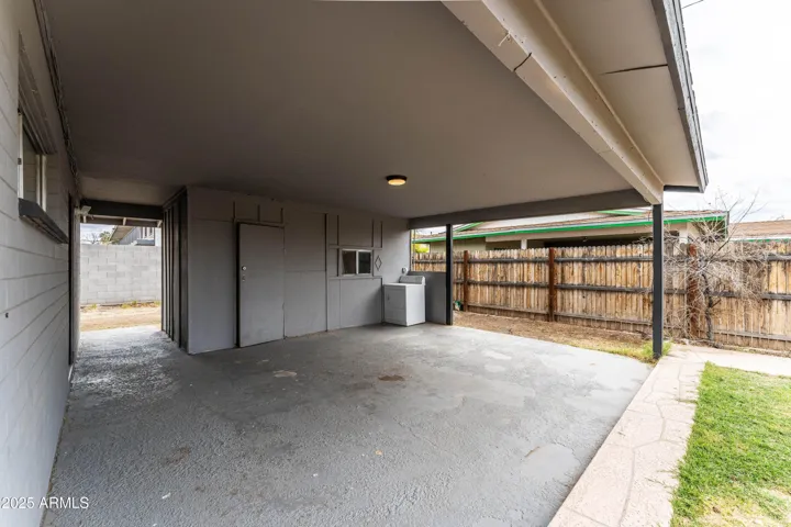 Carport with shared dryer.