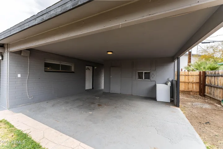 Carport with shared dryer.