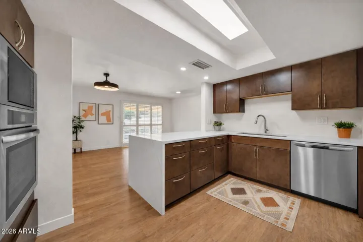 Remodeled kitchen with contemporary cabinets & new SS appliances - virtually staged
