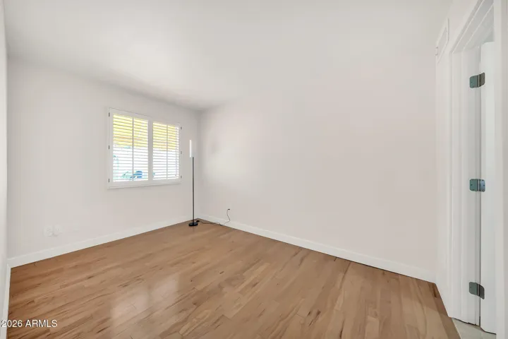 2nd bedroom with window to back patio