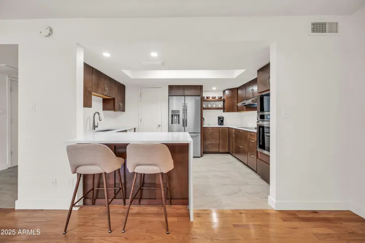Remodeled kitchen with contemporary cabinets & new SS appliances