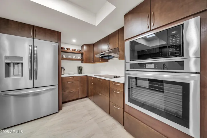 Remodeled kitchen with contemporary cabinets & new SS appliances