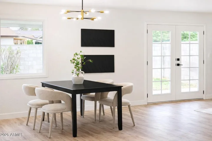 Dedicated dining space with contemporary lighting and seamless indoor-outdoor flow