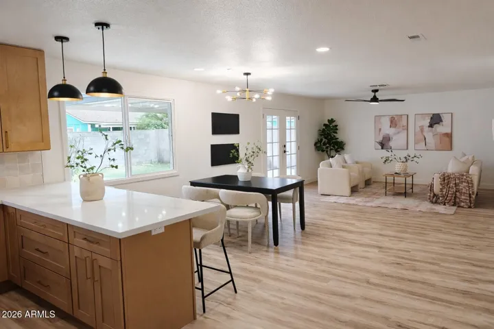 Spacious open-concept layout connecting kitchen, dining, and family room