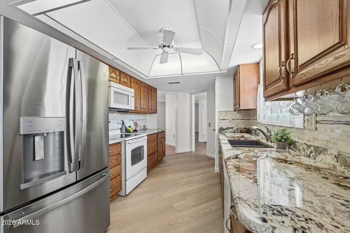 Granite Countertops, tiled backsplash & eat in kitchen nook