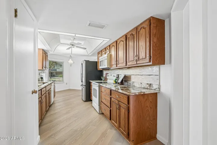 Granite Countertops, tiled backsplash & eat in kitchen nook