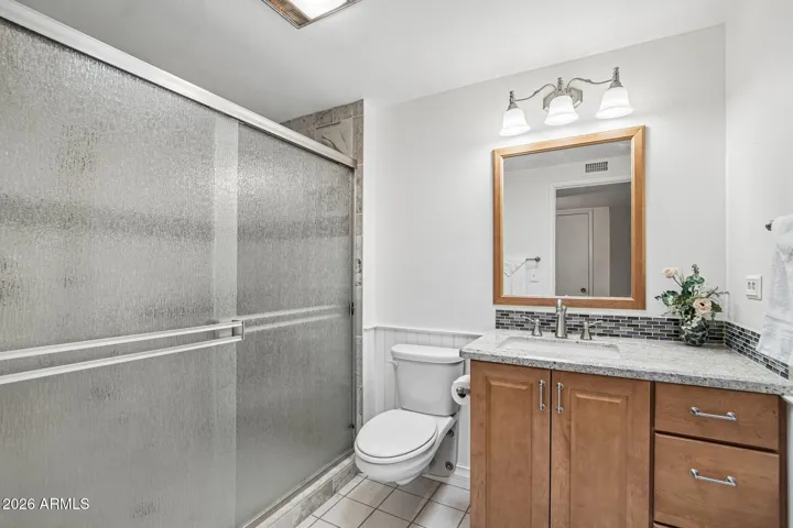 With Tiled Walk in shower & glass shower doors