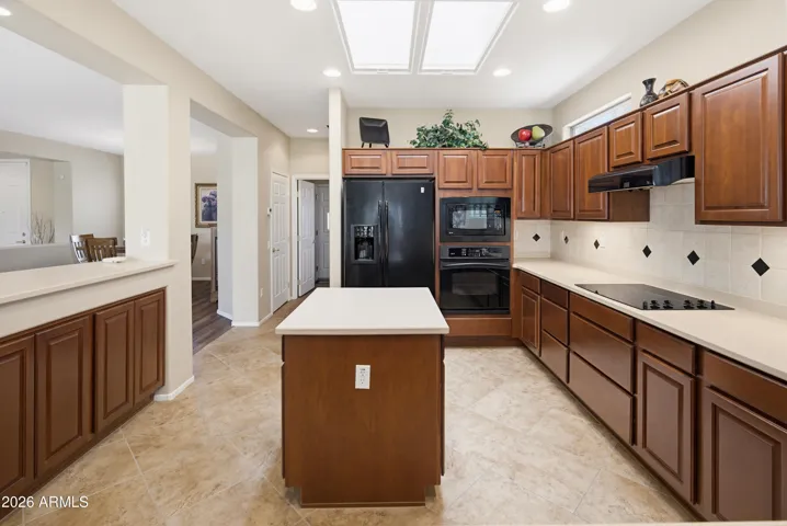 Lots of cherry cabinets and corian counters.