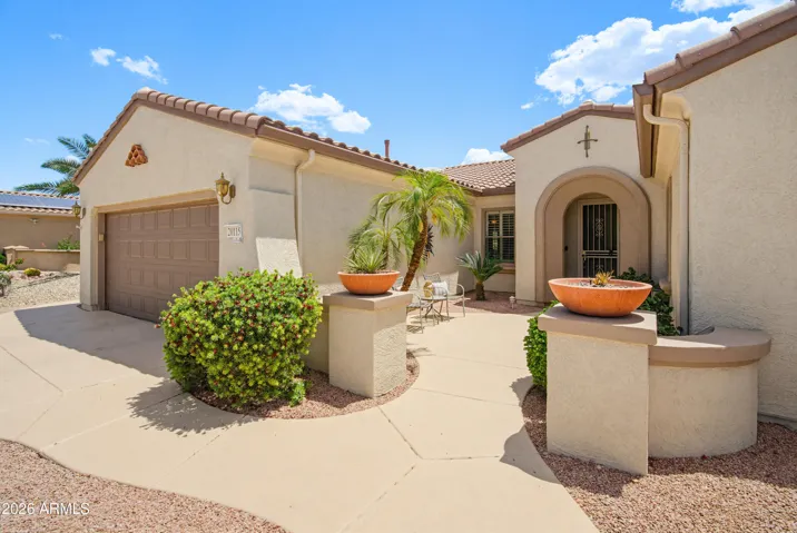 Inviting front courtyard. Wonderful curb appeal. This home shows beautifully both inside and outside.