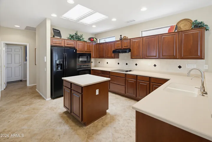Kitchen is light and bright. See the 2 sky lights?
