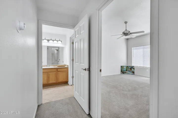 Bathroom entry from the the living room, door to the right leads to bedroom #1