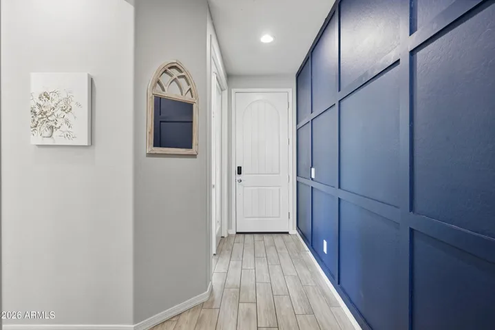 This thoughtful feature wall welcomes you home