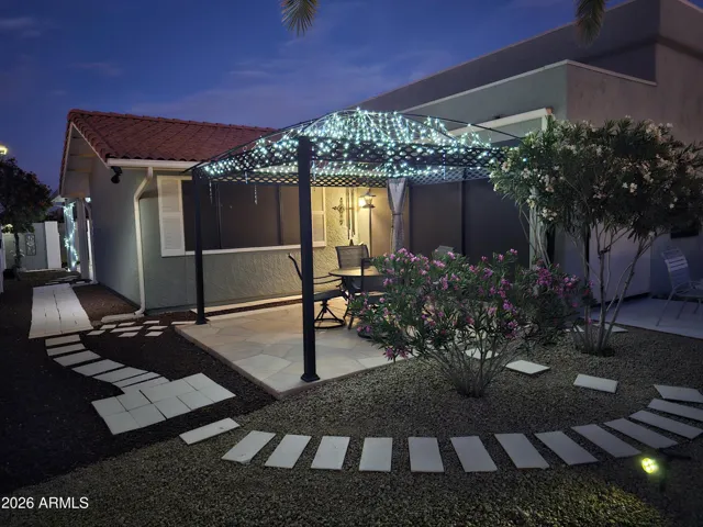 Enjoy sitting under the lit gazebo.
