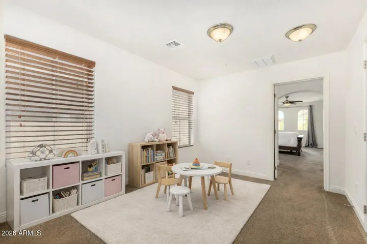 The upstairs loft offers a versatile bonus space, ideal for a play area, home office, or additional living space.
