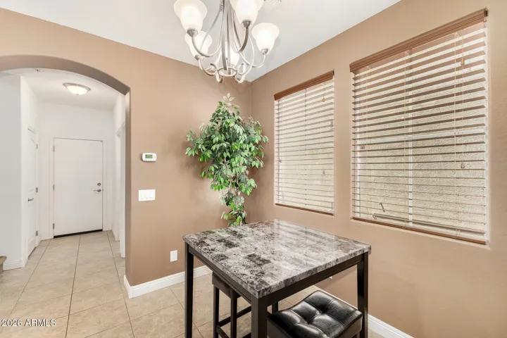 The dining area offers a cozy and functional space just off the kitchen.