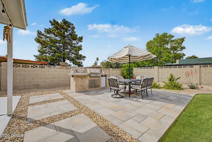 Backyard remodeled in 2024! Check out the stone-look modular pavers!