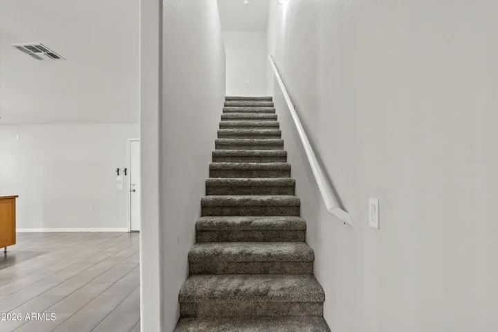 Stairs to bedrooms and laundry