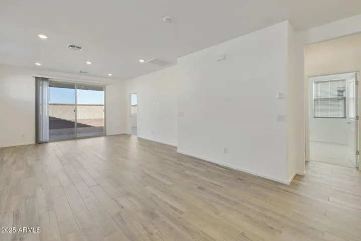 BEAUTIFUL WOOD PLANK TILE FLOORING THROUGHOUT MINUS THE BEDROOMS