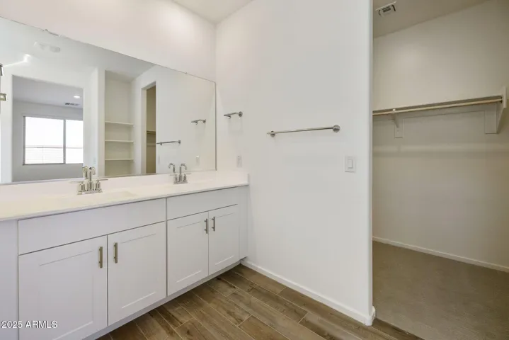 DUAL VANITIES WITH PAINTED CABINETS LARGE SHOWER AND WALK IN CLOSET