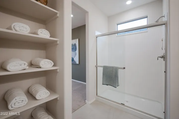 DUAL VANITIES WITH PAINTED CABINETS LARGE SHOWER AND WALK IN CLOSET