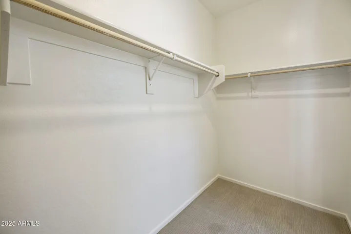 DUAL VANITIES WITH PAINTED CABINETS LARGE SHOWER AND WALK IN CLOSET