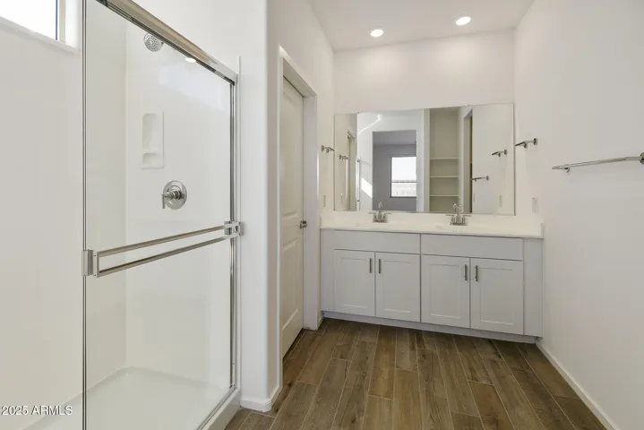 DUAL VANITIES WITH PAINTED CABINETS LARGE SHOWER AND WALK IN CLOSET