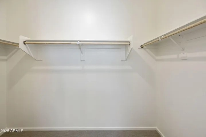 DUAL VANITIES WITH PAINTED CABINETS LARGE SHOWER AND WALK IN CLOSET