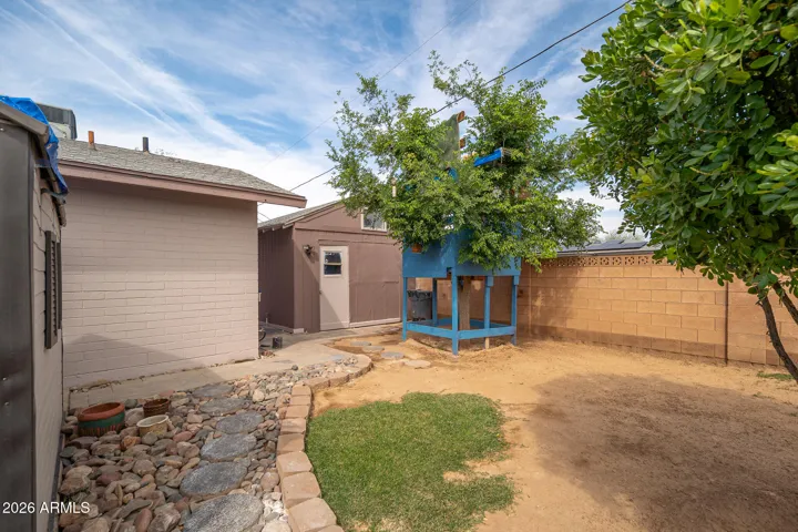 1 of 2 entrances to detached workshop & "office" with electricity + window a/c.
