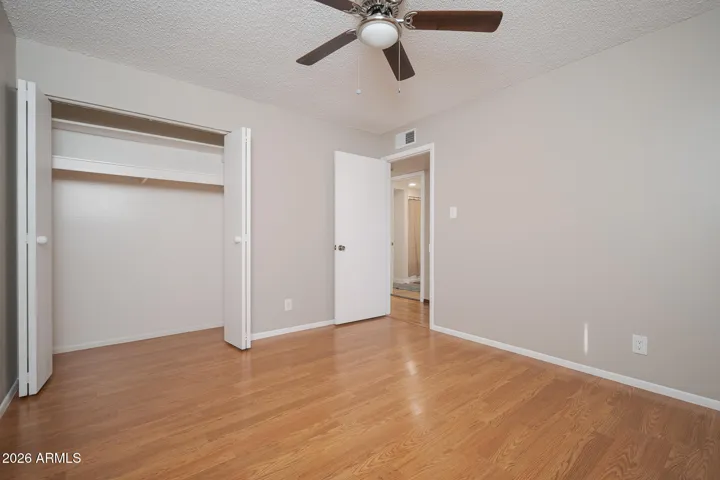 Laminate wood floors + ceiling fan.