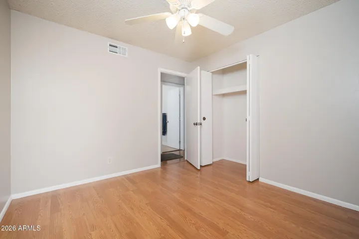 Laminate wood floors + ceiling fan.