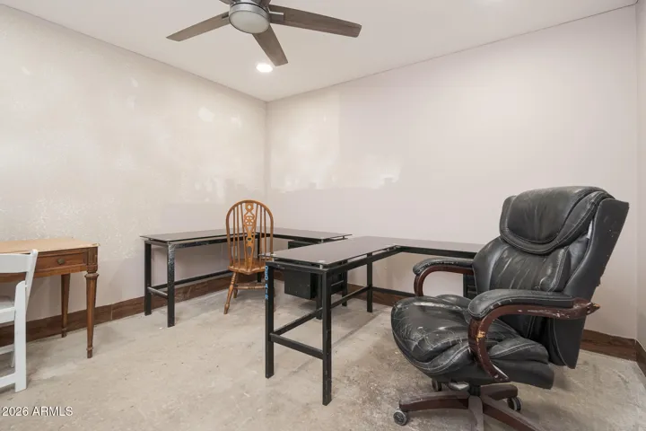 "Office space" with window a/c off workshop area - complete with recessed lighting and ceiling fan.
