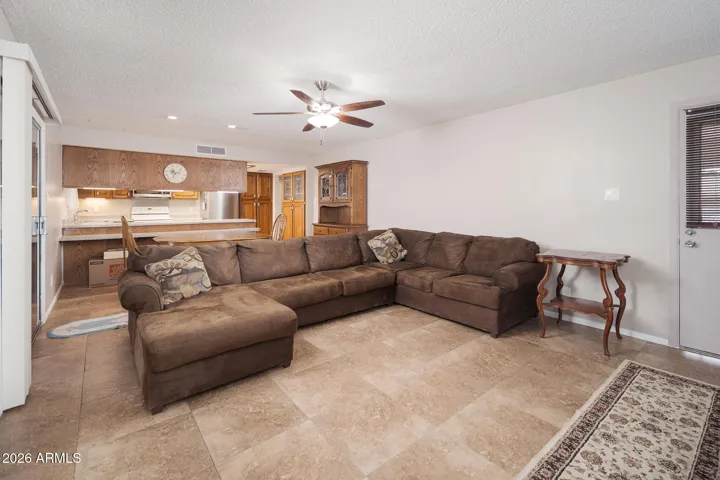 Family room has exit to back patio + exit to 2-car carport.