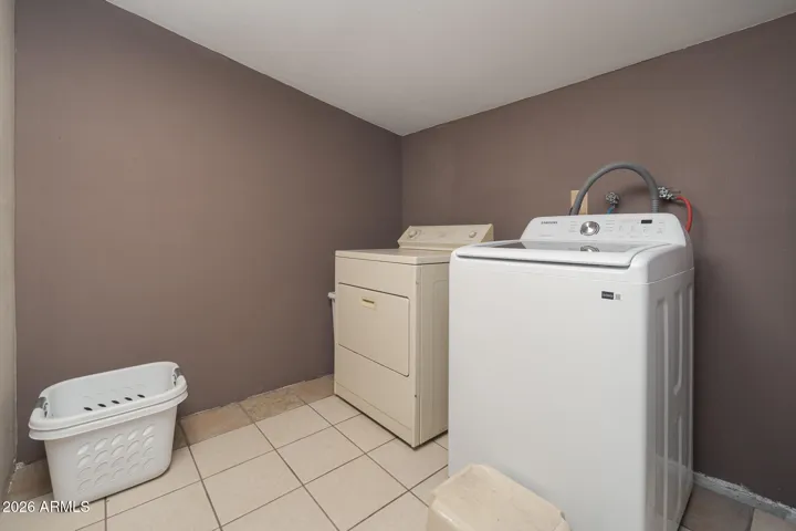 Laundry area off covered patio.