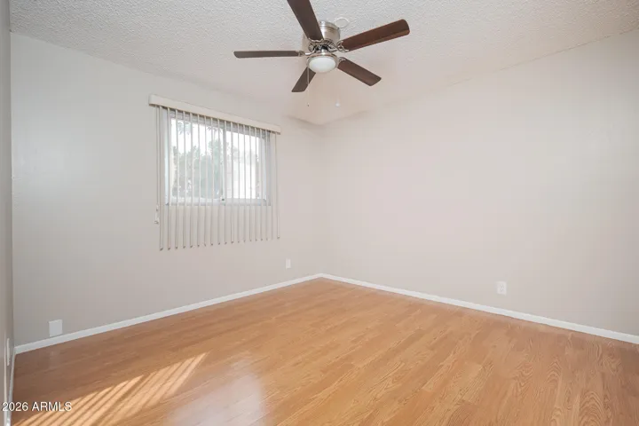 Laminate wood floors + ceiling fan.