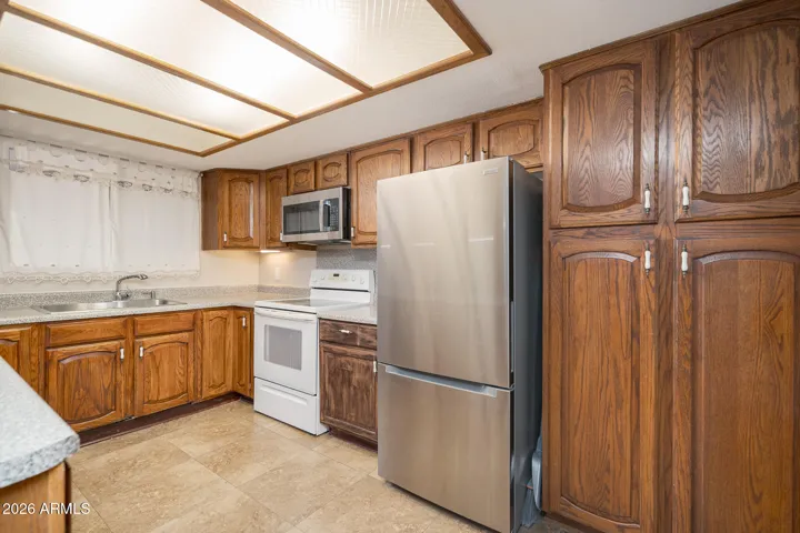 Nice flat-top range + built-in microwave + pantry storage.
