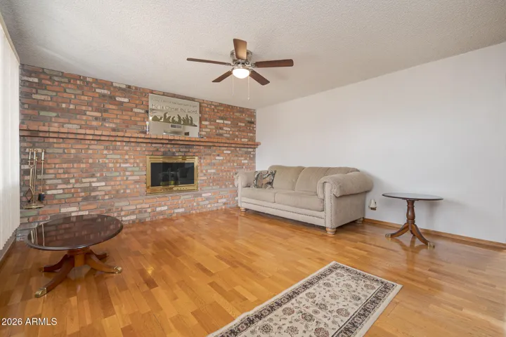 Real wood-burning fireplace. Real wood floors throughout living room + hallway.