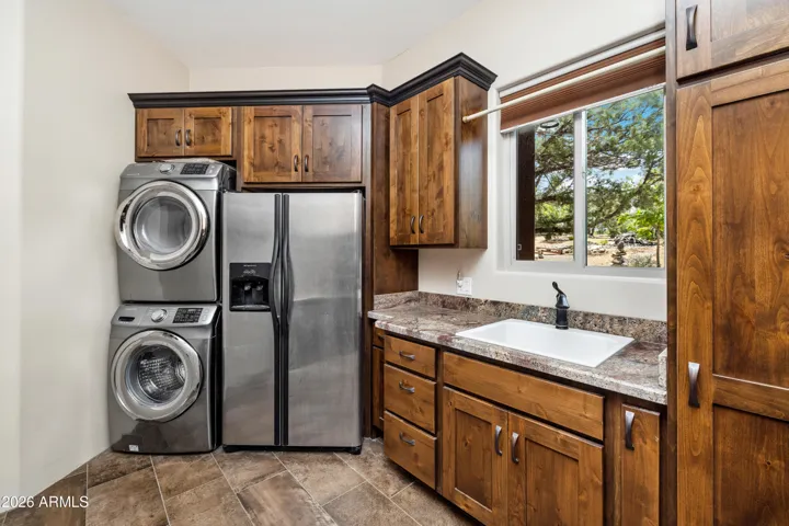 Plenty of storage, a utility sink, and room for an extra refrigerator