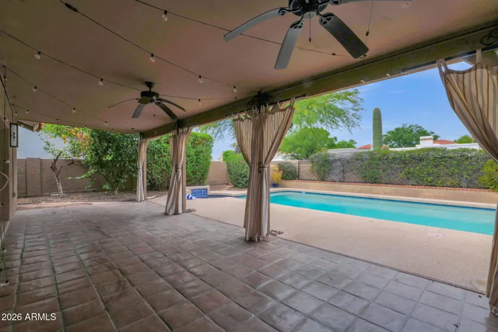 Expansive outdoor seating with privacy/shade curtains