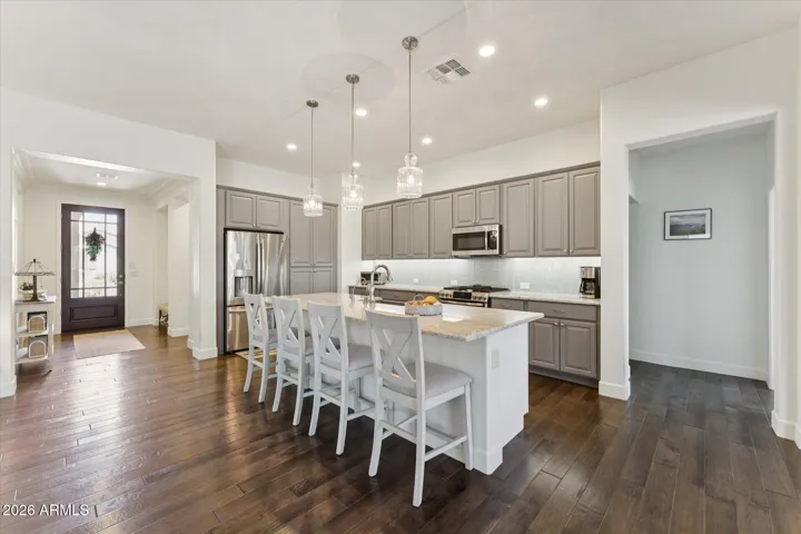 Stainless Steel gas appliances and a built-in Keurig coffee maker inside the refrigerator!