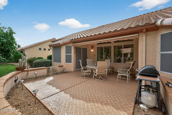 Relax and unwind on the extended patio w/knee wall.