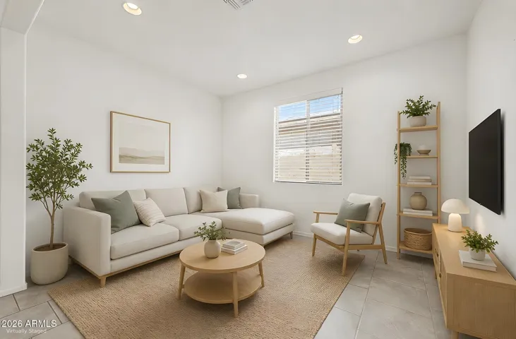 Flexible Front Living Space: Den Option or Bedroom Conversion. Digitally Staged.