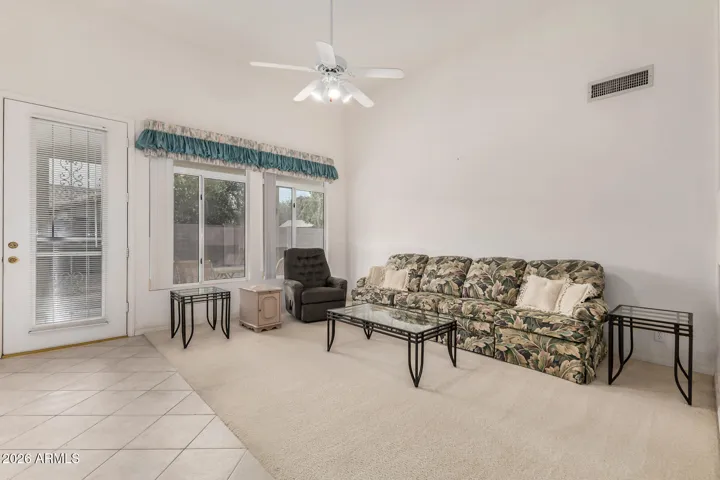 Ample living room with a door that leads to your new backyard!