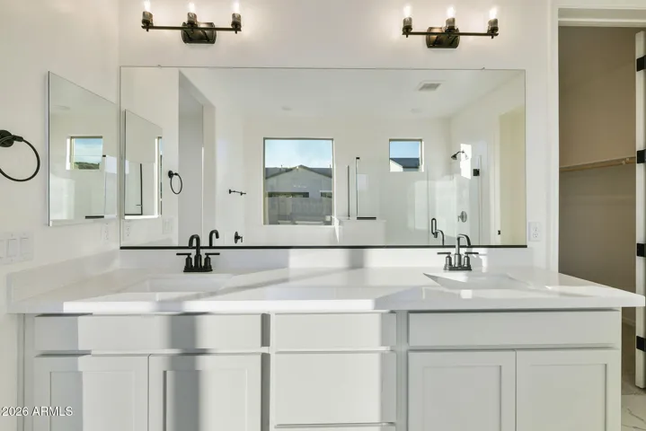 DUAL VANITIES, SEPARATE TUB AND SHOWER, LINEN CLOSET AND LARGE WALK IN CLOSET