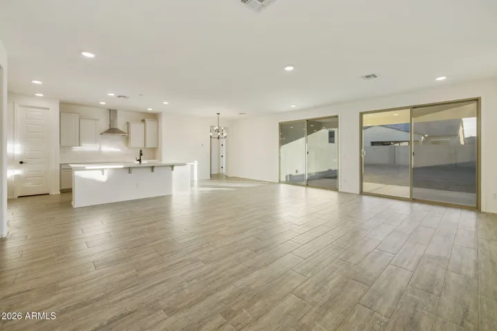 BEAUTIFUL GOURMET KITCHEN WITH BUILT-IN APPLIANCES, PAINTED CABINETS, QUARTZ COUNTERS AND DESIGNER BACKSPLASH.