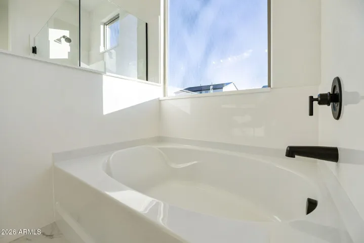 DUAL VANITIES, SEPARATE TUB AND SHOWER, LINEN CLOSET AND LARGE WALK IN CLOSET