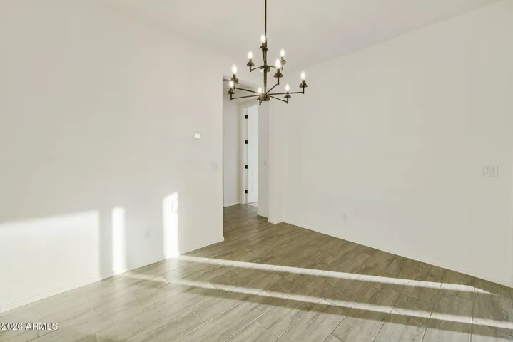 BEAUTIFUL WOOD PLANK TILE FLOORING THROUGHOUT MINUS THE BEDROOMS.