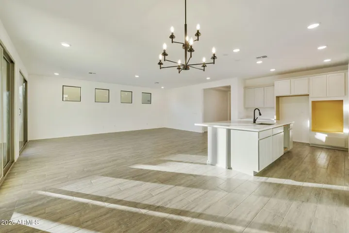 BEAUTIFUL WOOD PLANK TILE FLOORING THROUGHOUT MINUS THE BEDROOMS.