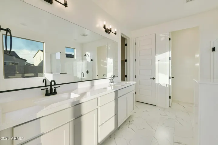 DUAL VANITIES, SEPARATE TUB AND SHOWER, LINEN CLOSET AND LARGE WALK IN CLOSET